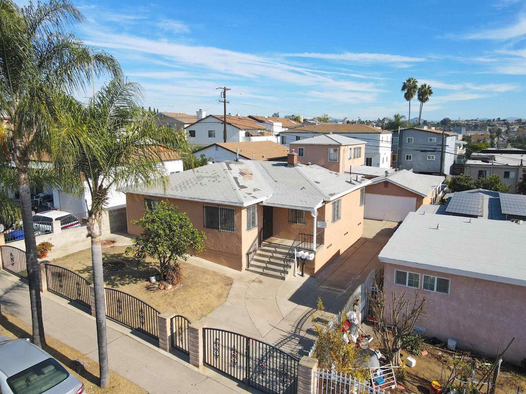 an aerial view of a residential apartment building with a yard