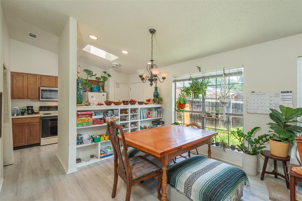 a dining room with furniture and wooden floor