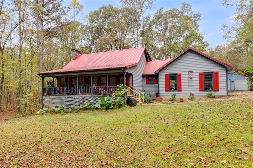 a front view of a house with a garden and porch