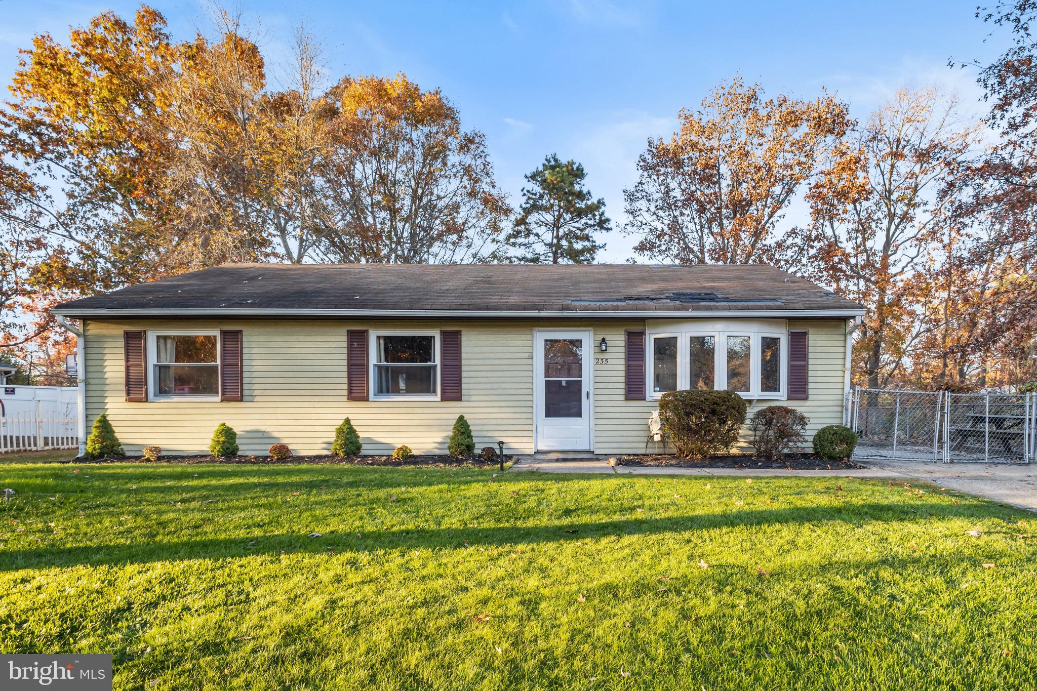 a front view of house with yard having outdoor seating