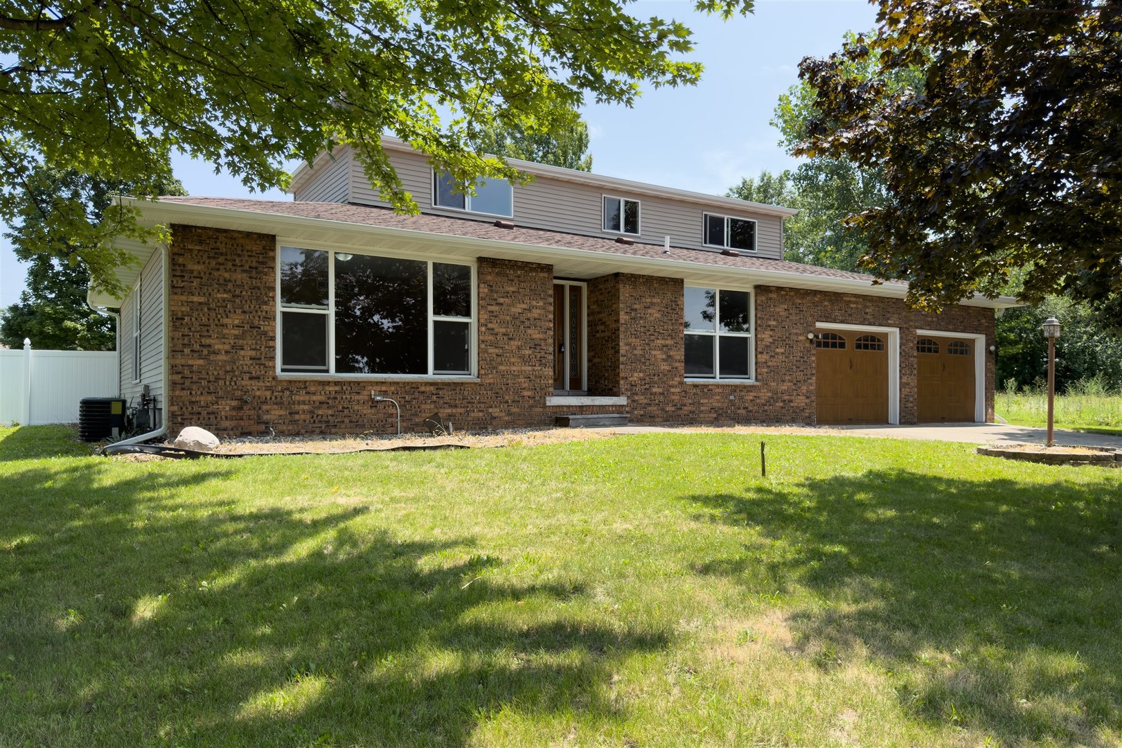 front view of a house that has a yard