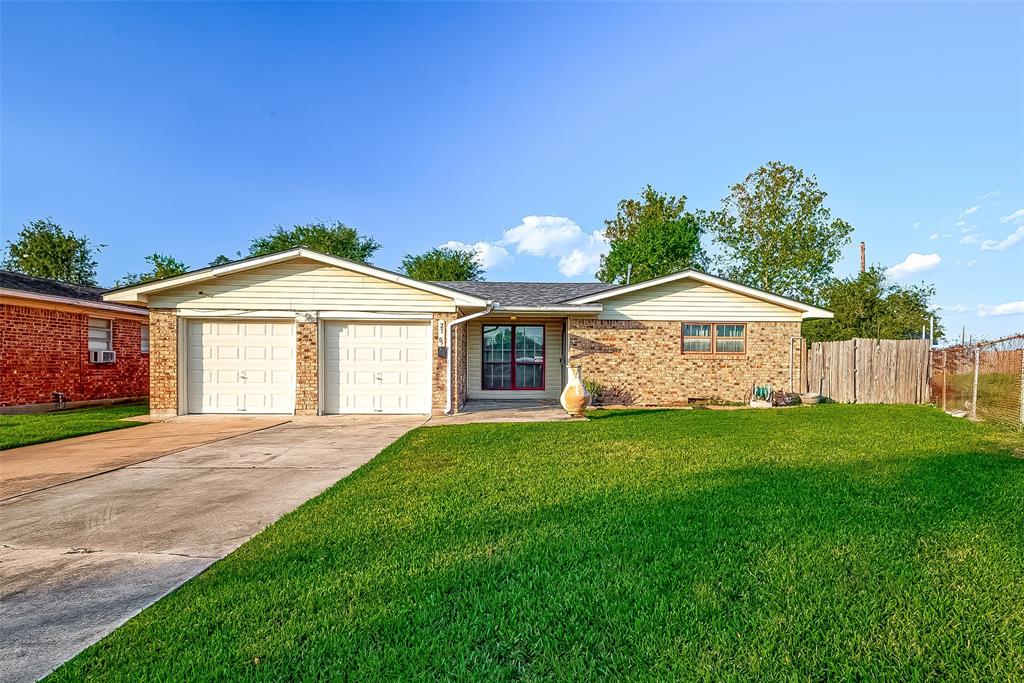 Welcome to this cozy one-story home with a wide driveway and a large, green lawn in the front. The simple, inviting exterior offers a peaceful and comfortable first impression.