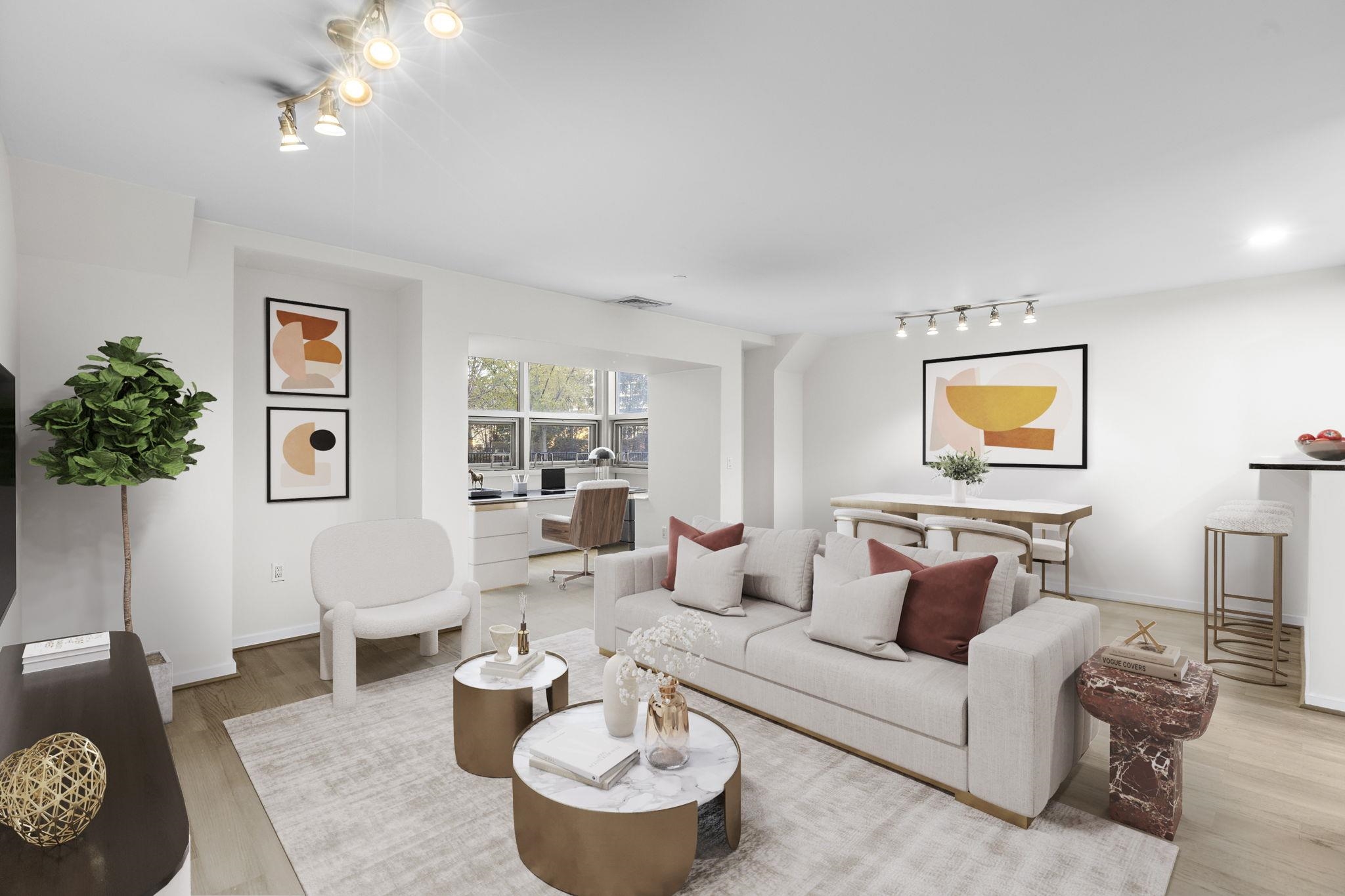 a living room with furniture and a potted plant