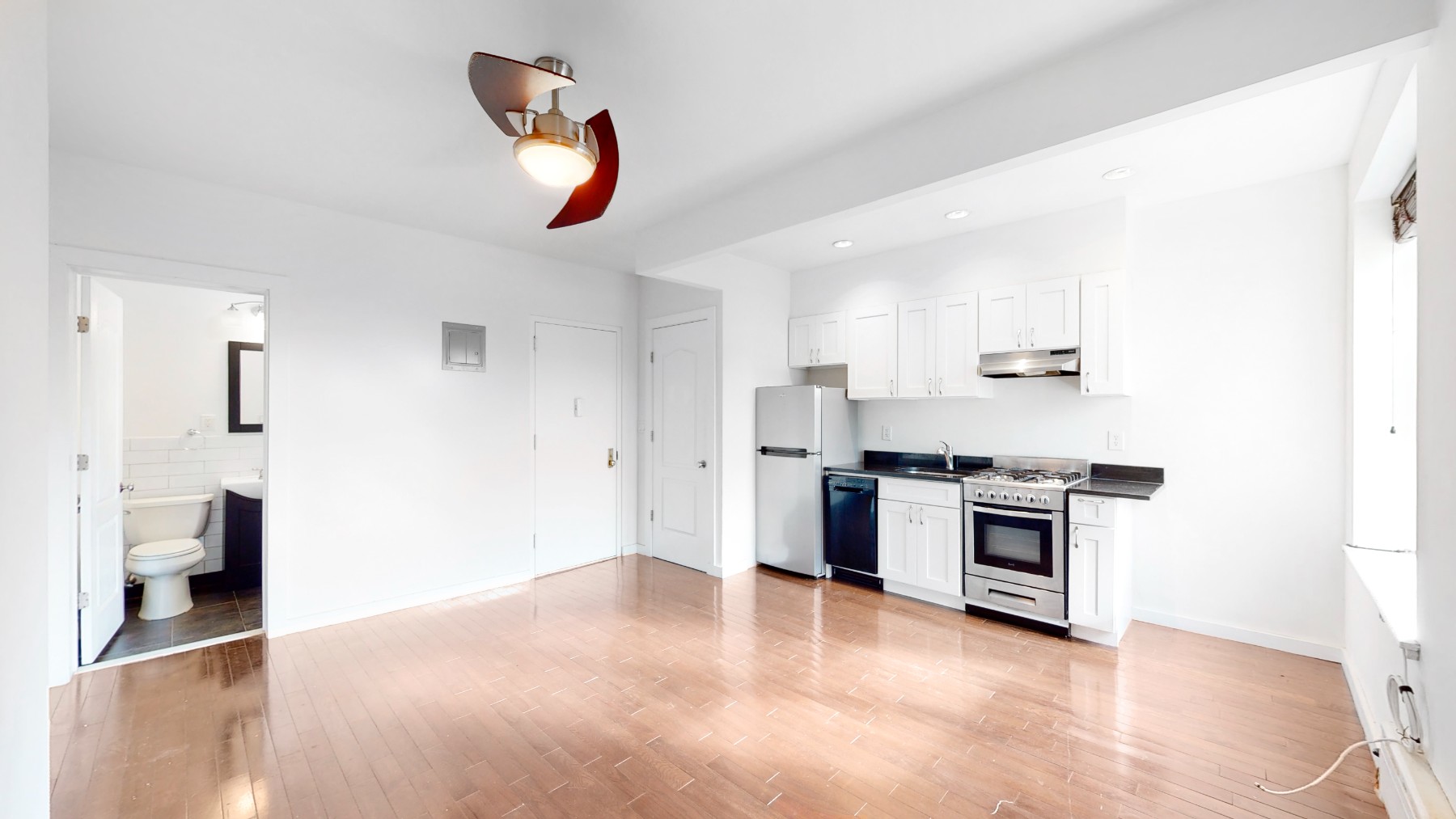 a kitchen with a stove and a refrigerator