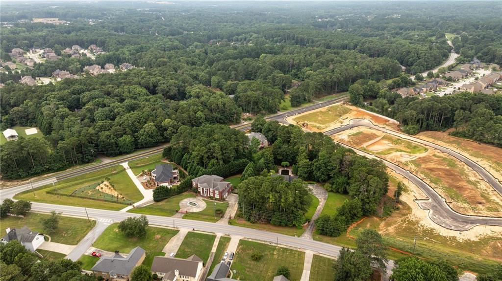 an aerial view of a house with a yard