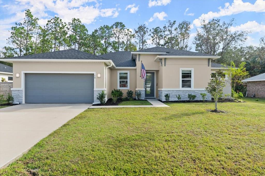 front view of a house with a yard