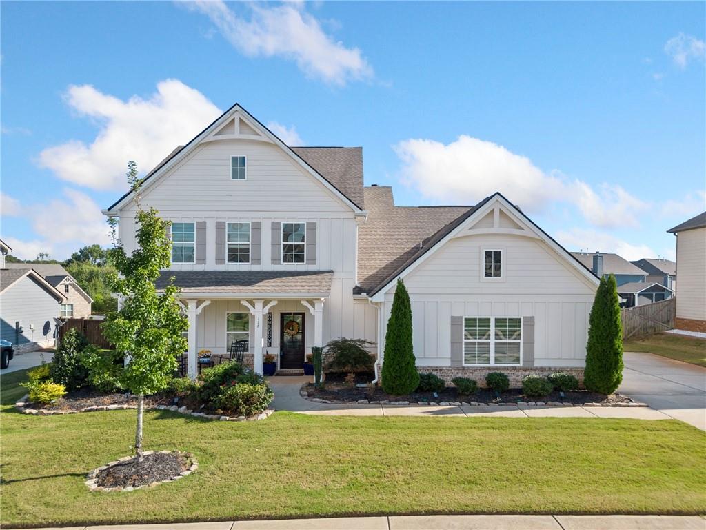 a front view of a house with a yard