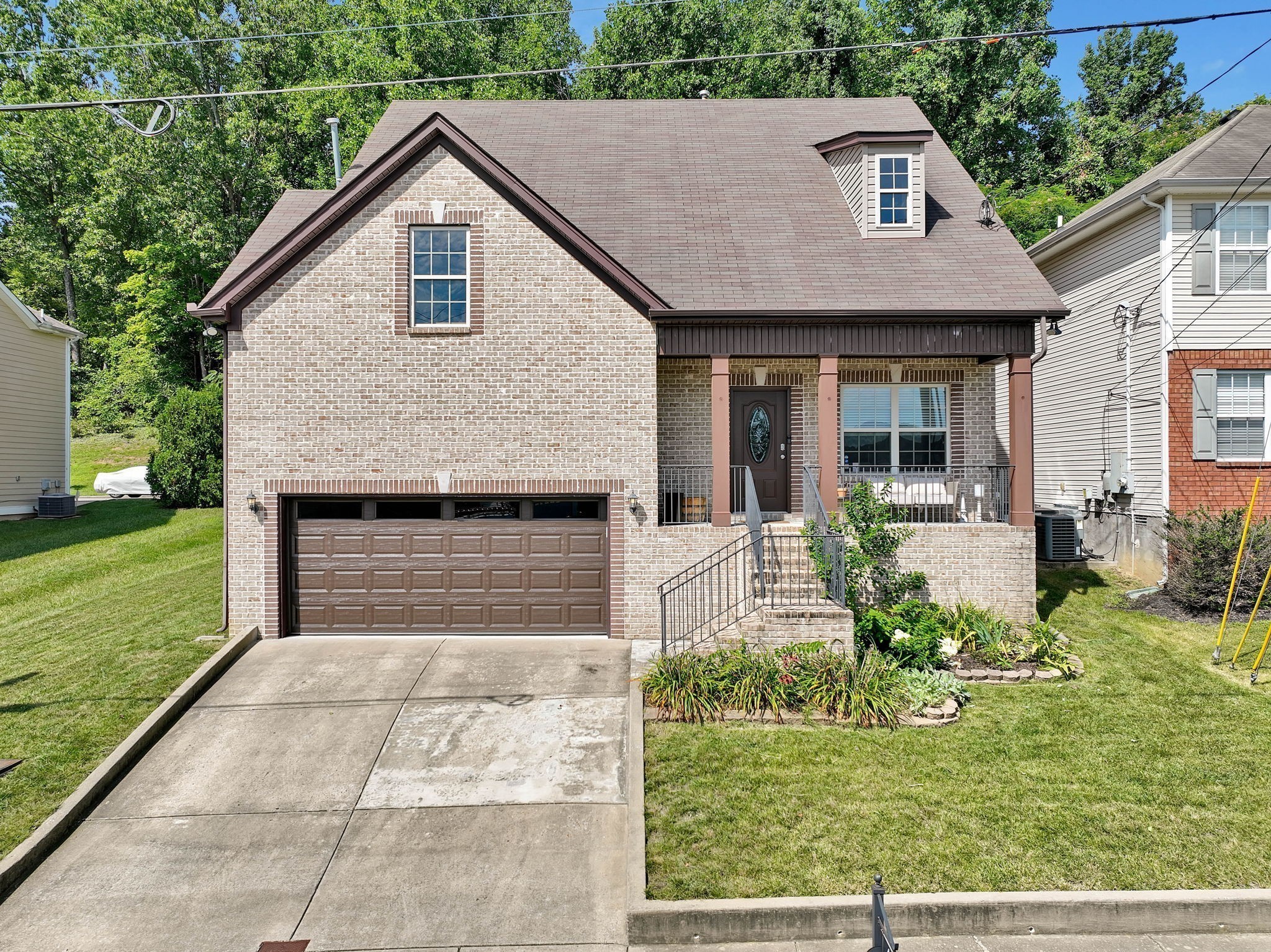 a front view of a house with garden