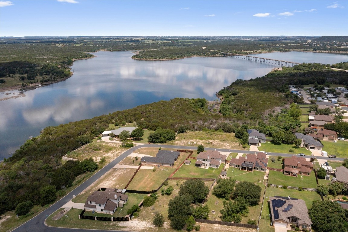 an aerial view of ocean residential house with outdoor space and lake view