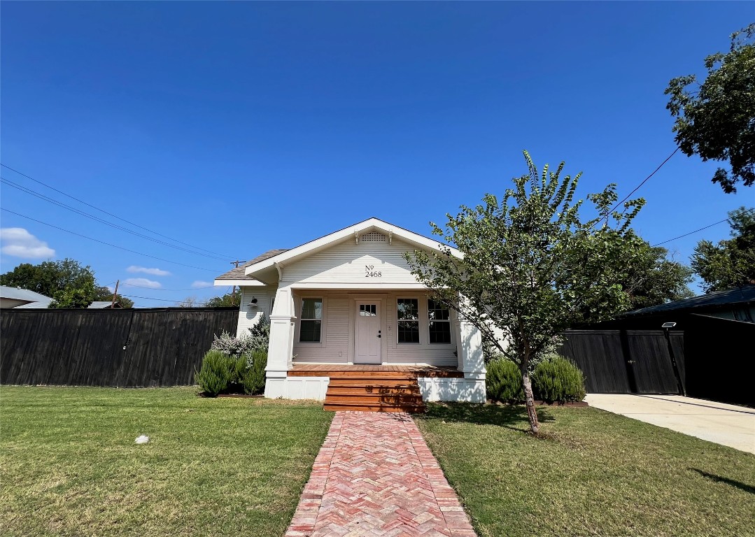 a front view of a house with yard