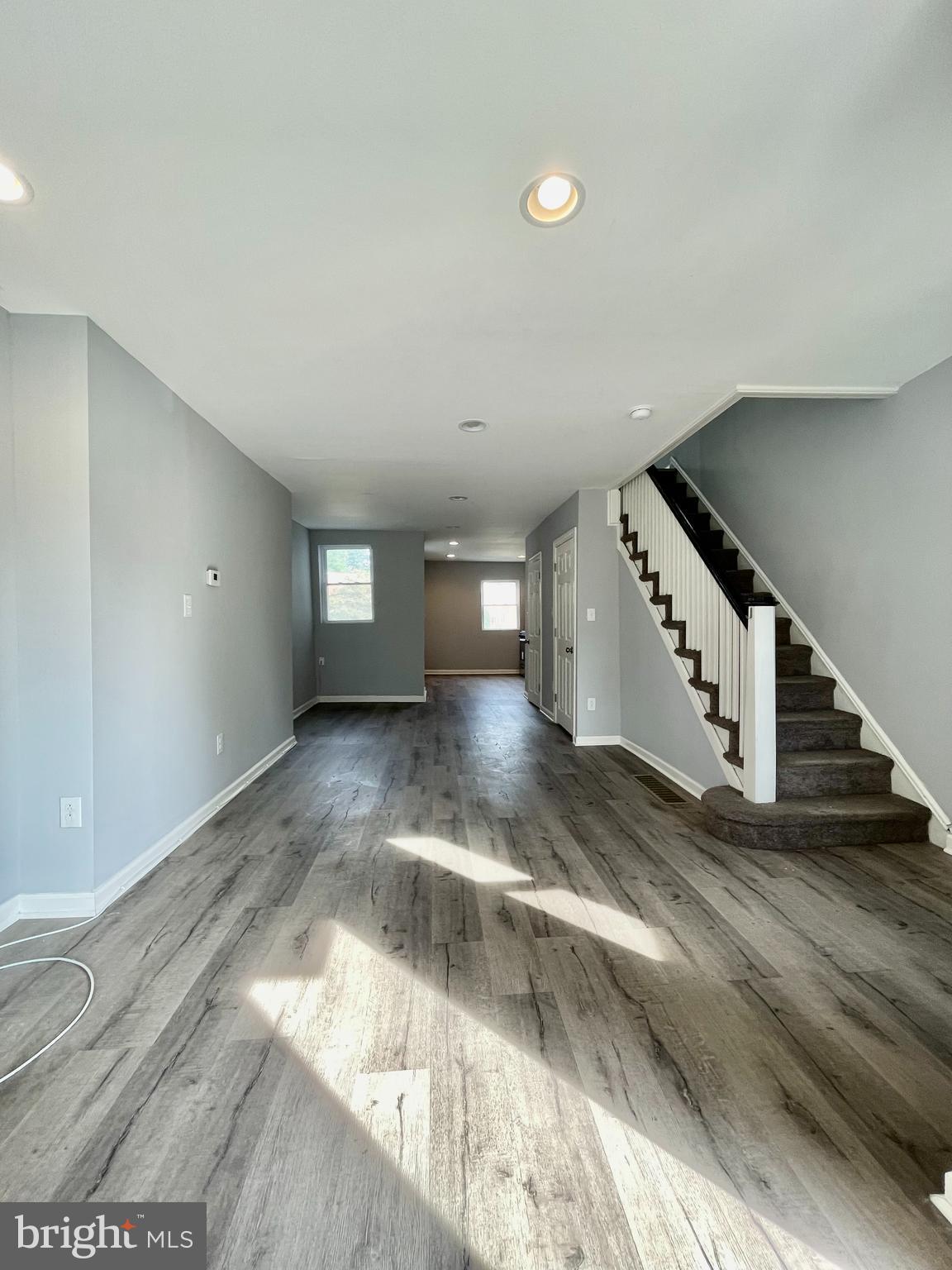 a view of a hallway with staircase