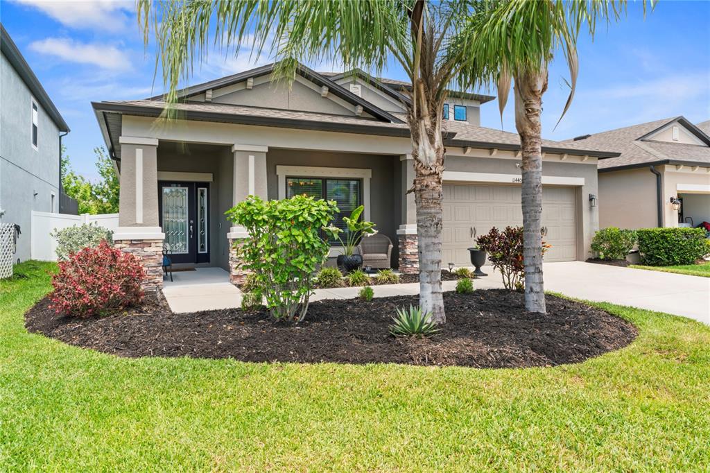 a front view of a house with garden