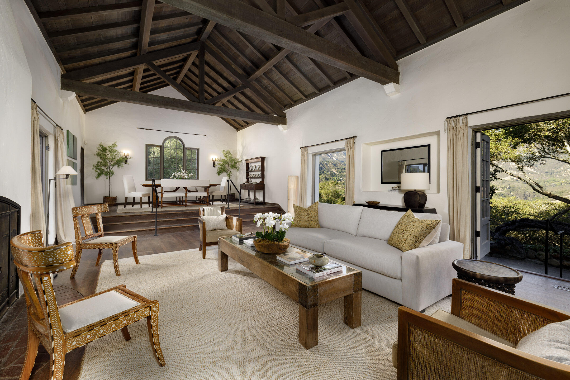 a living room with fireplace furniture and a flat screen tv