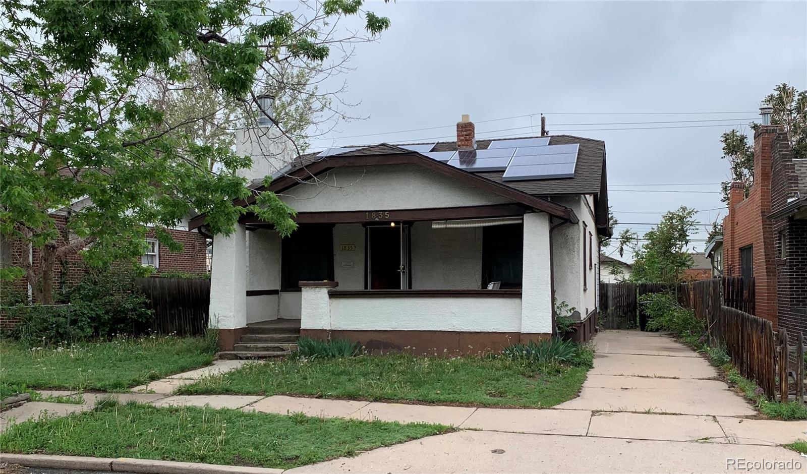 a front view of a house with garage