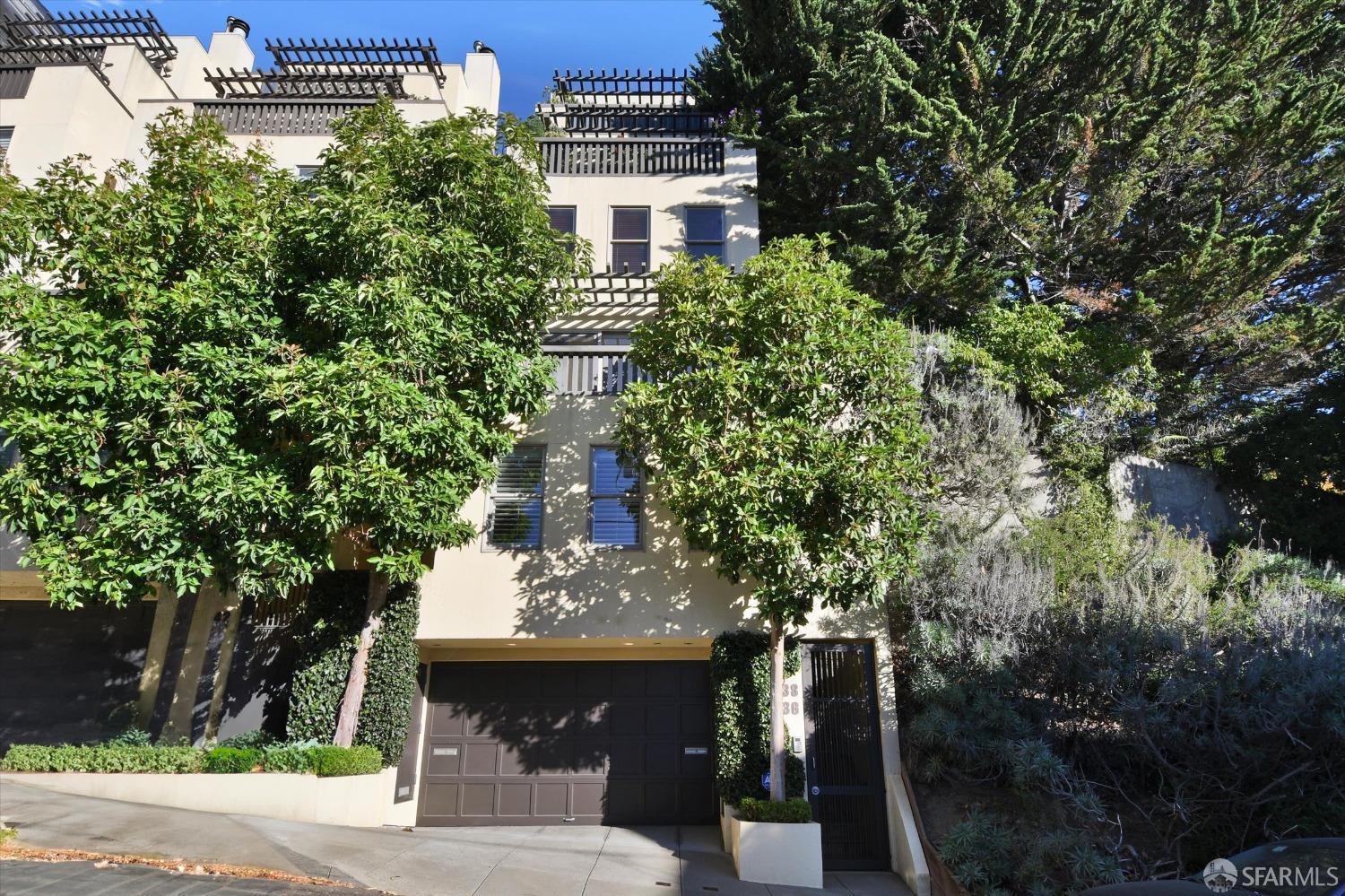 a view of a building and trees all around