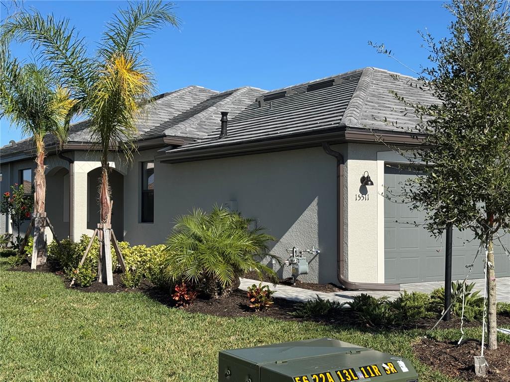 a front view of a house with garden