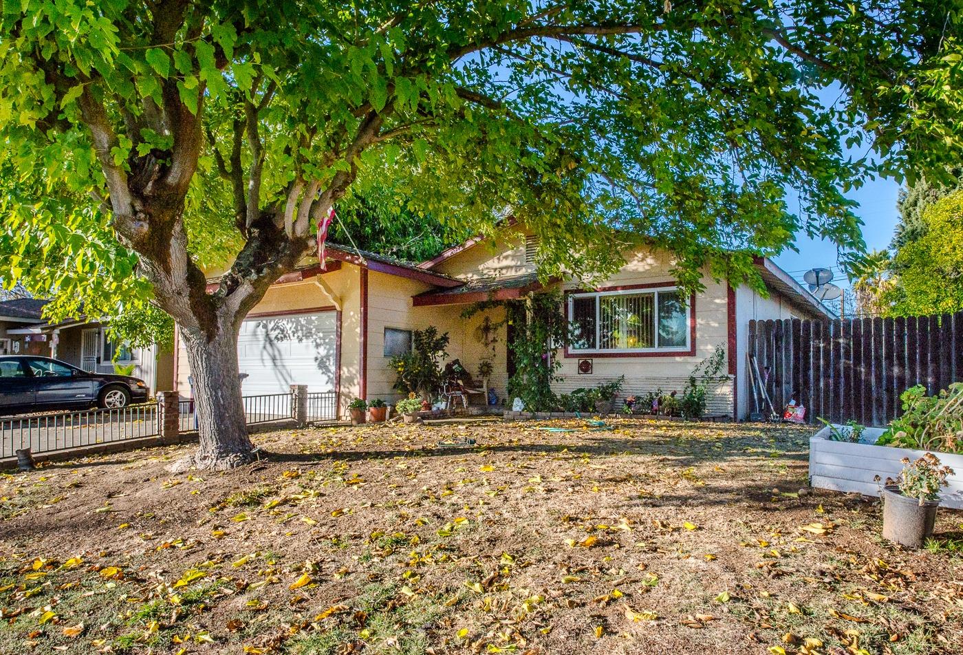 a front view of a house with a yard