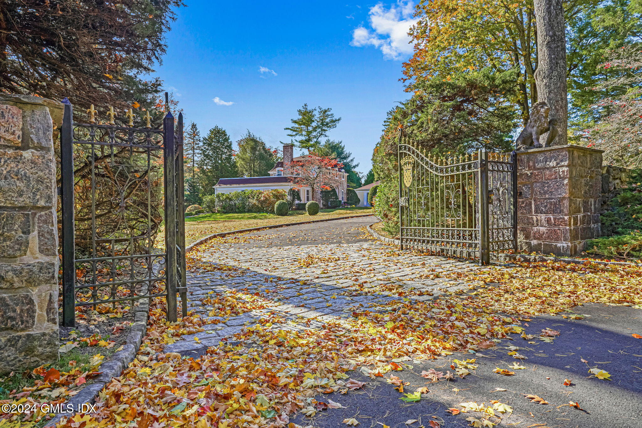 a view of a pathway of a house with a yard