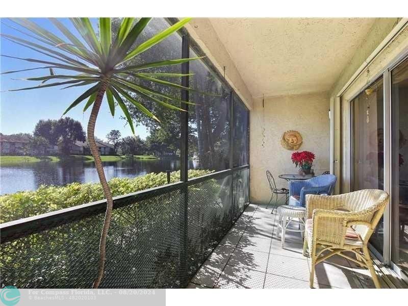 a balcony view with a sitting space