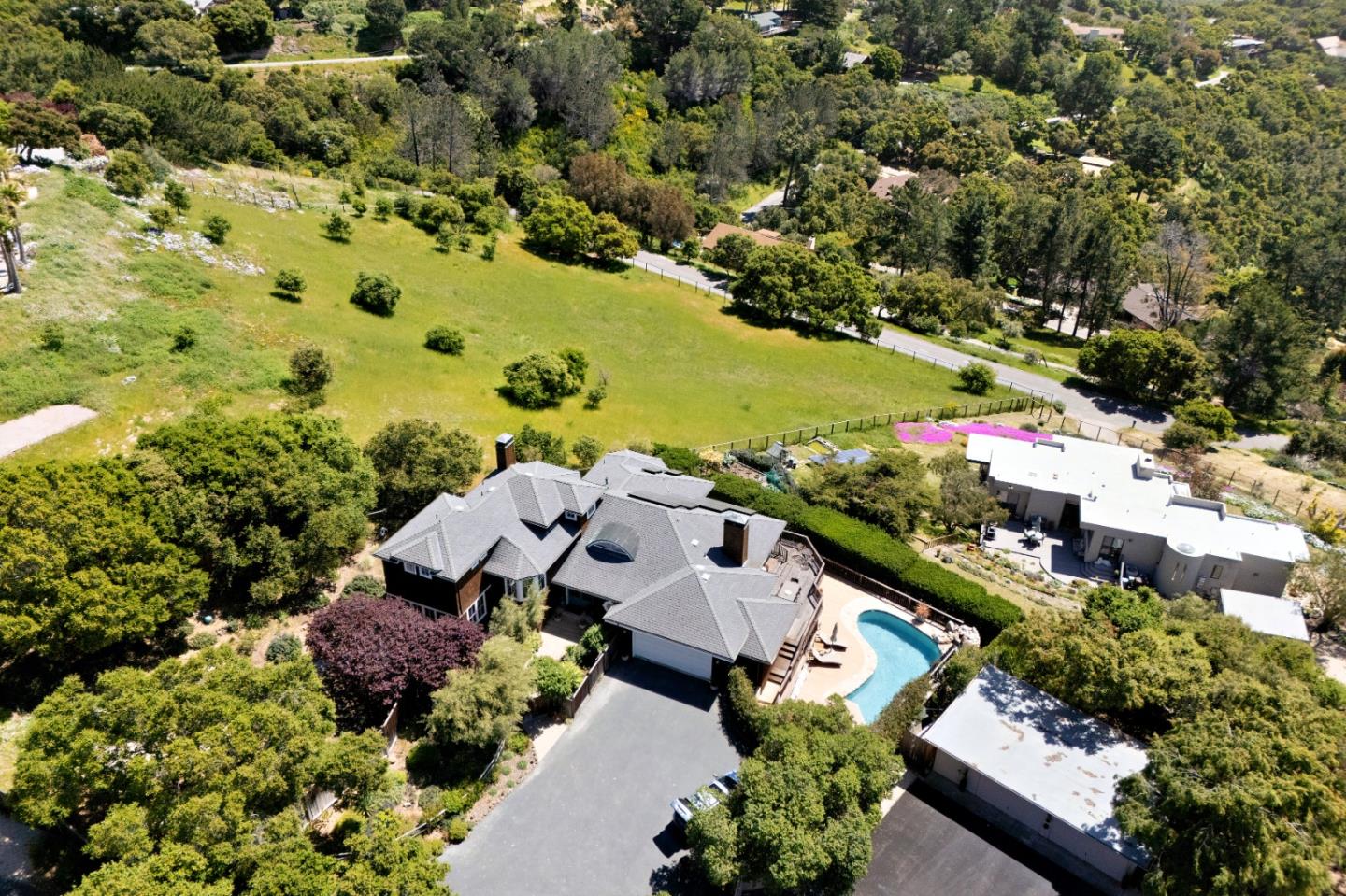 an aerial view of residential houses with outdoor space