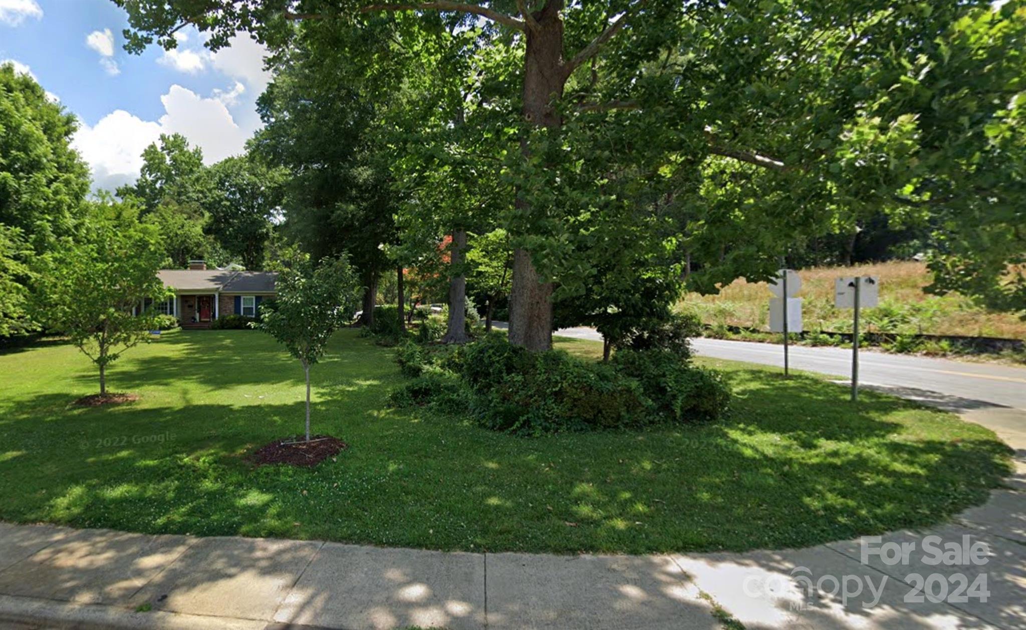 a view of a backyard with a garden