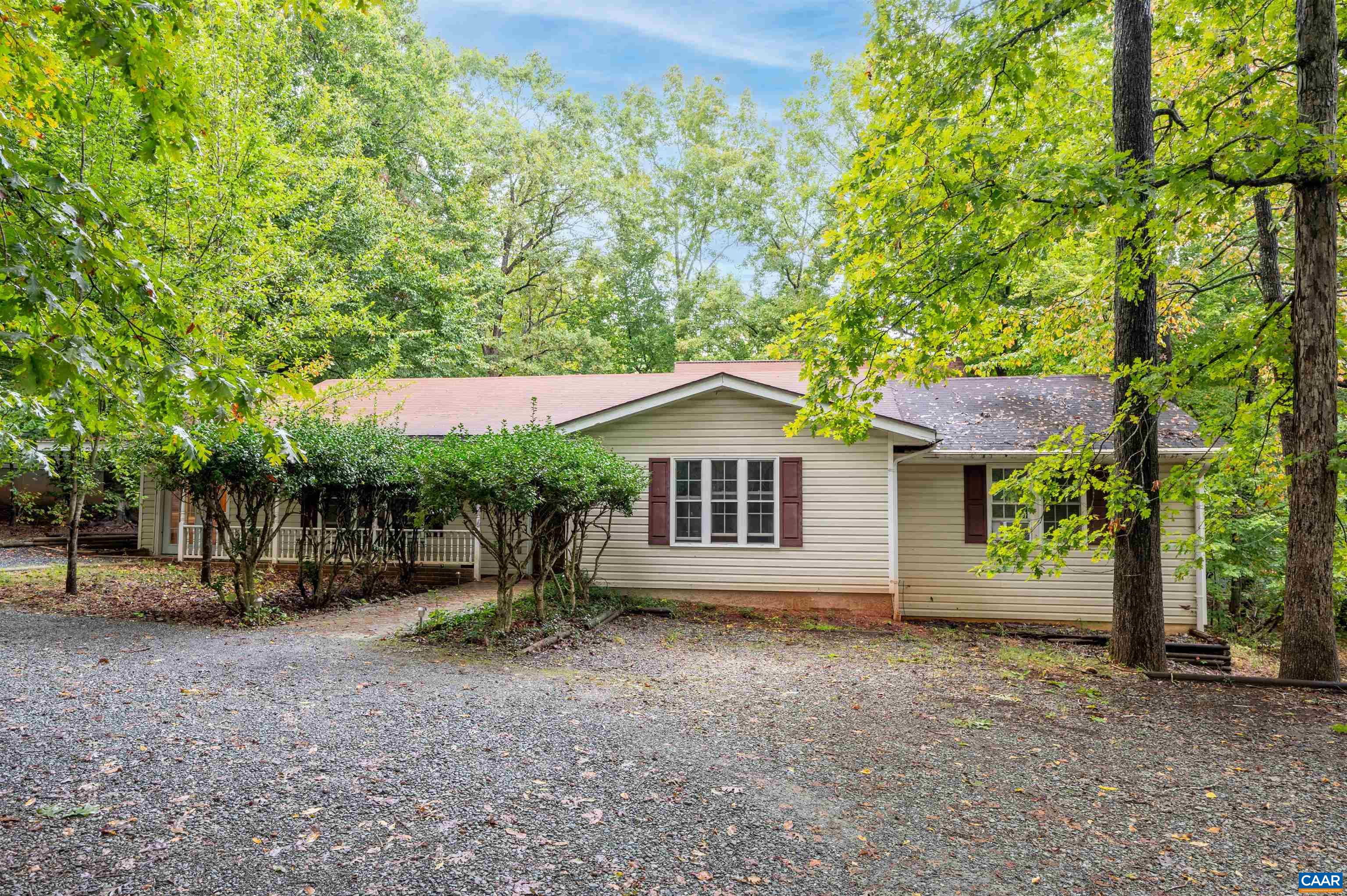 front view of a house with a tree