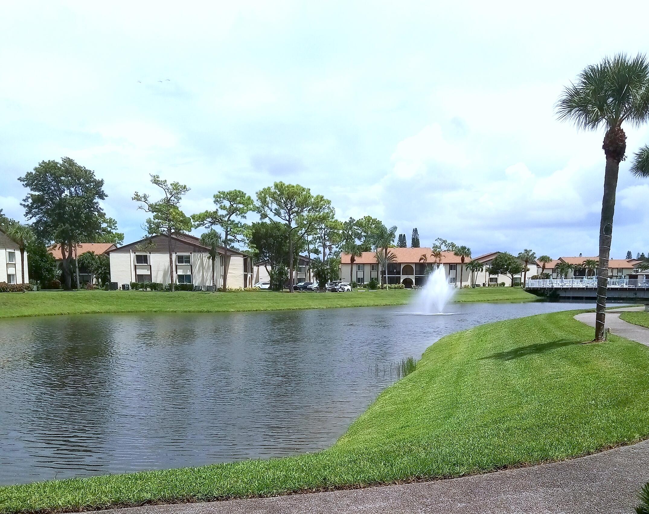 a view of building with river in front of it