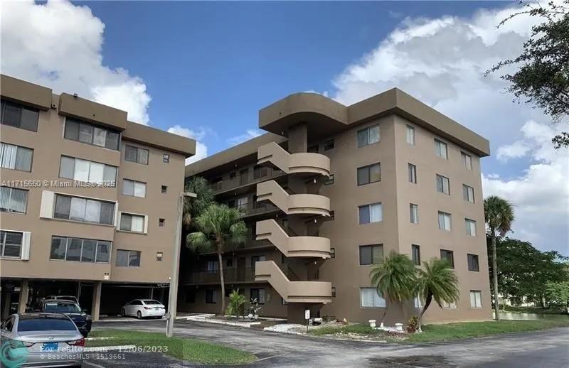 a front view of a building with street view