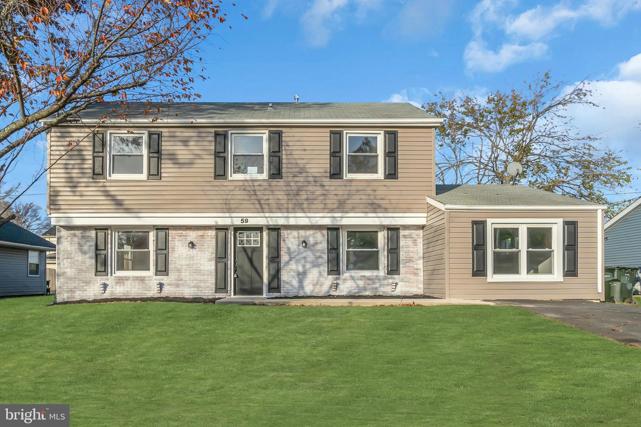 front view of a house with a yard