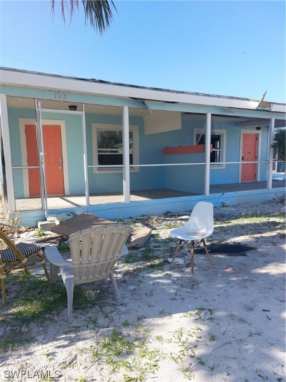 a front view of house with yard outdoor seating and barbeque oven