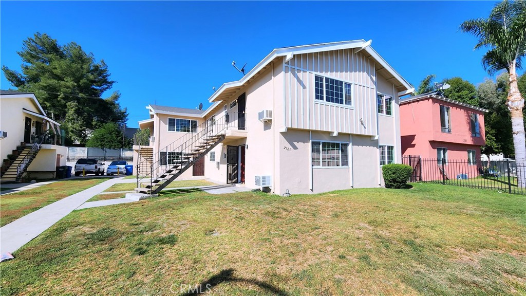 a view of a house with a yard and garage