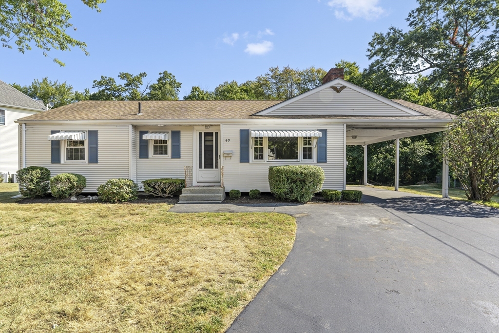 front view of a house with a patio