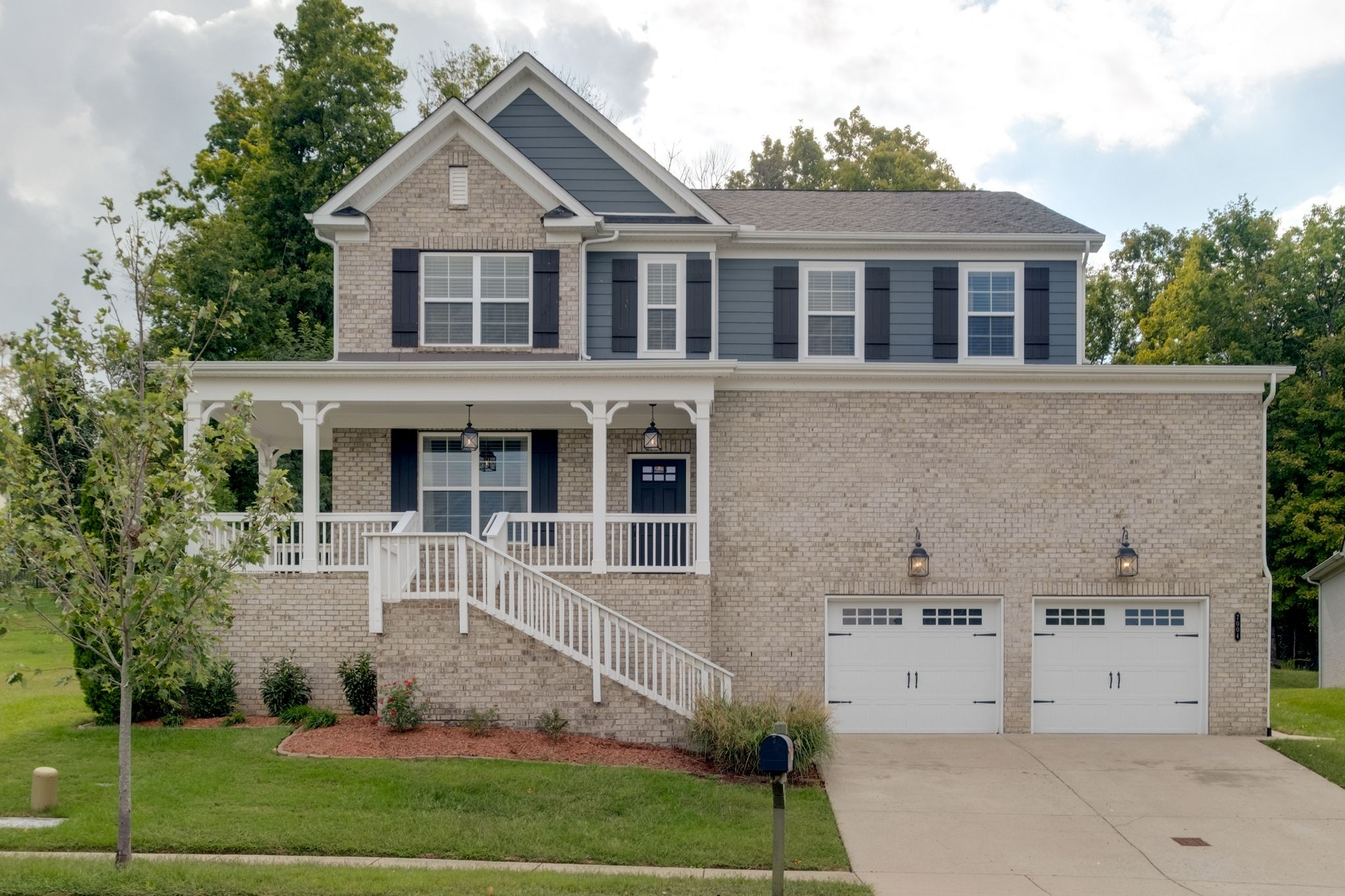 front view of a house with a yard