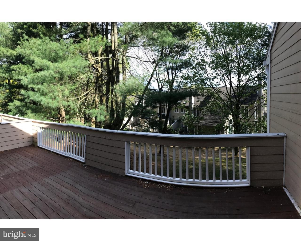 a view of balcony with wooden floor