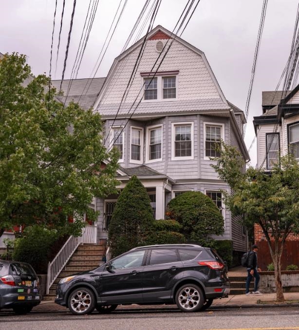 a car parked in front of a house