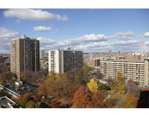 a view of a city with tall buildings