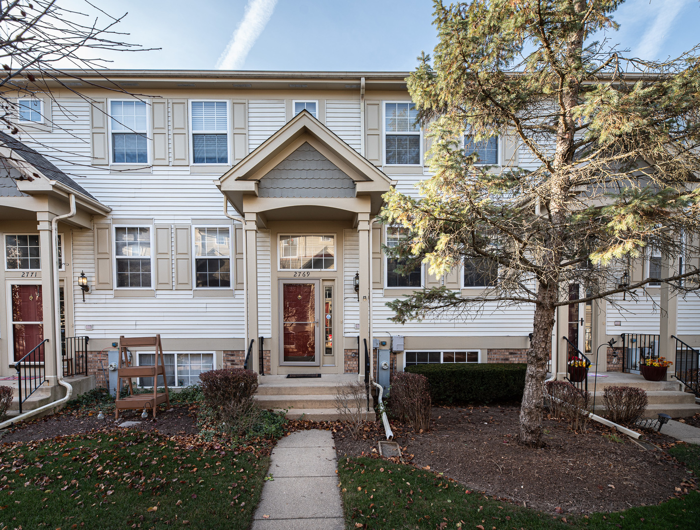 a front view of a house with a yard