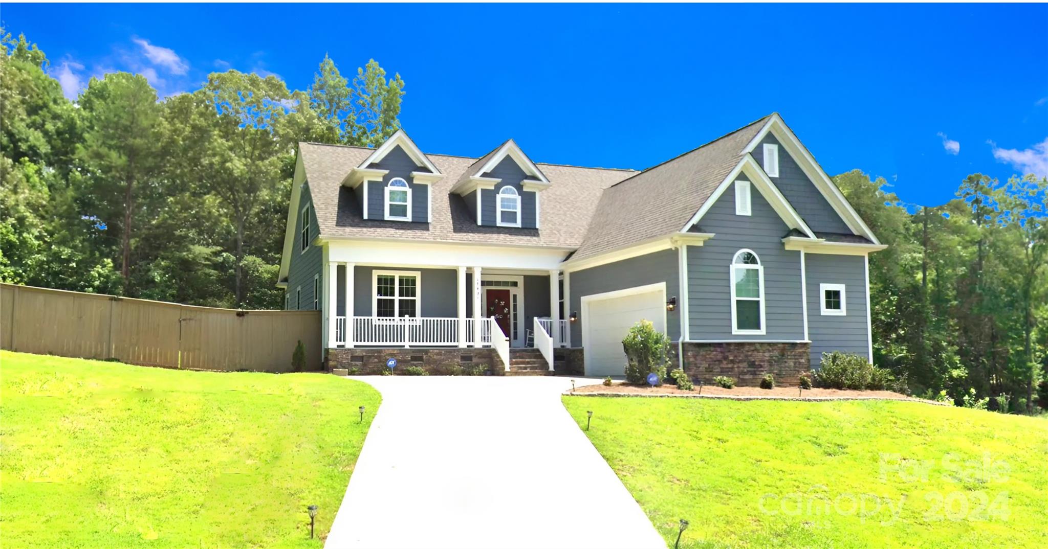 a front view of a house with a yard