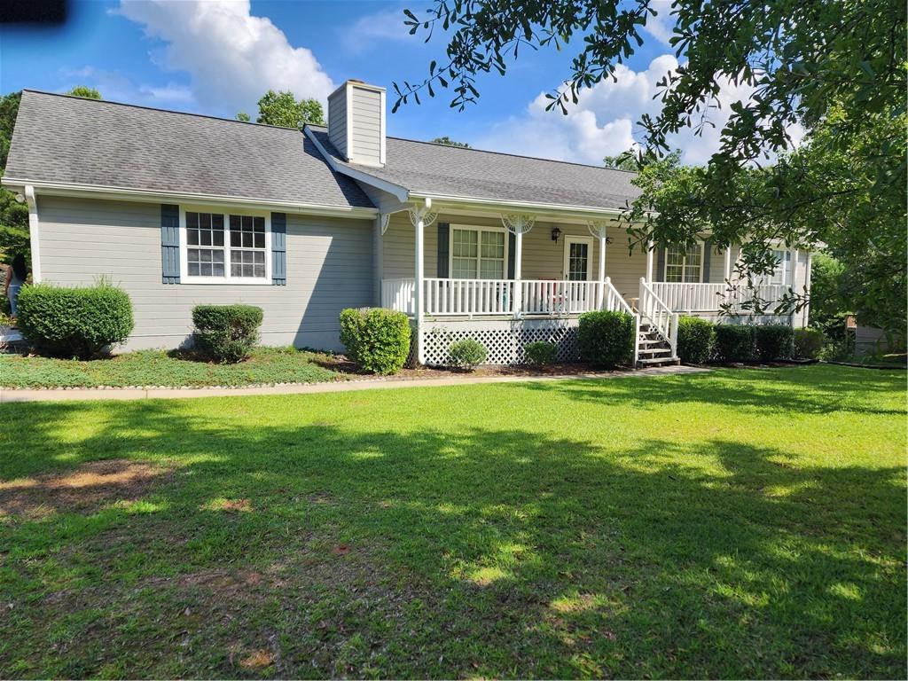 a front view of a house with a yard