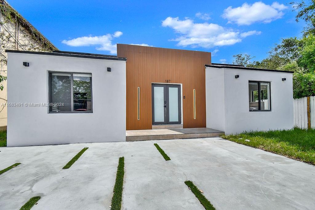 a view of backyard of a house