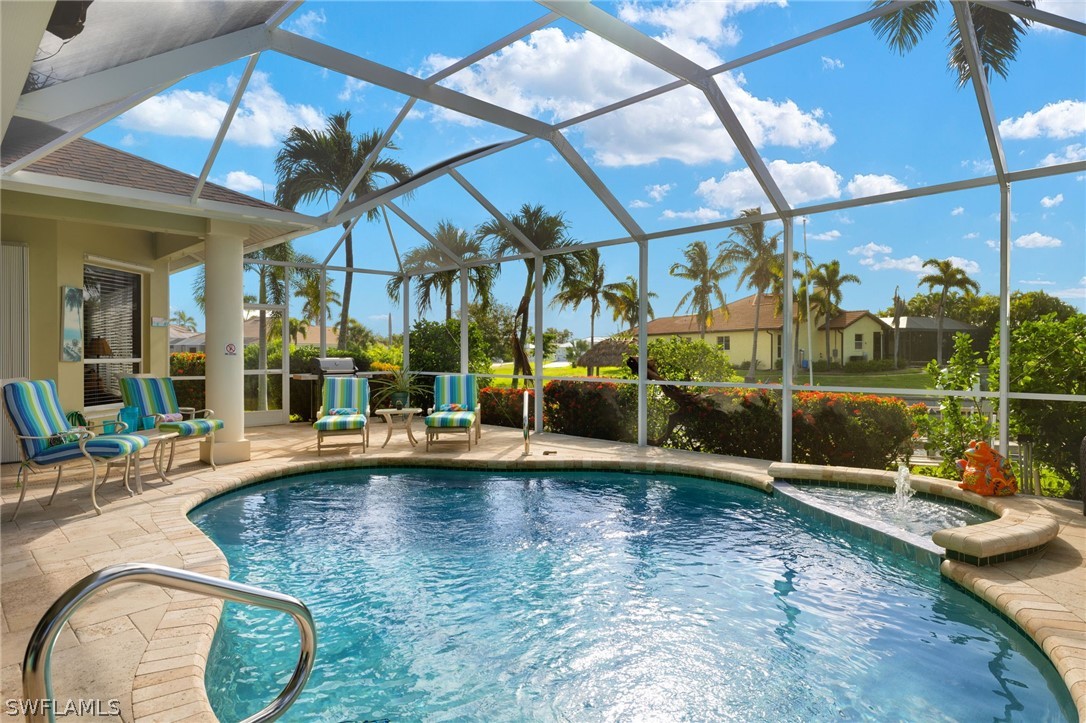 a swimming pool with outdoor seating and yard