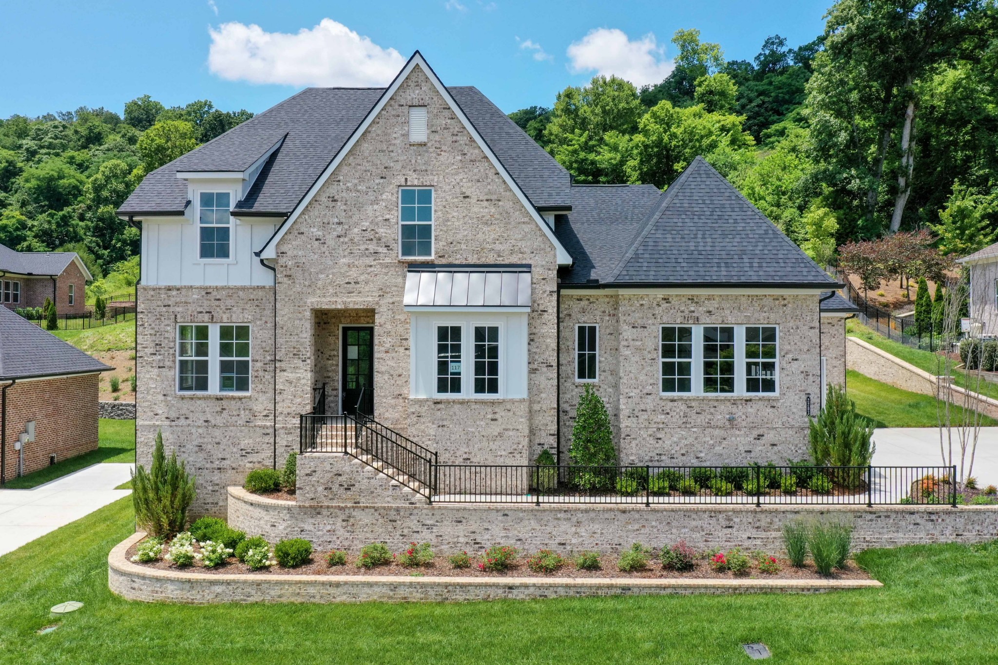 a front view of a house with a yard