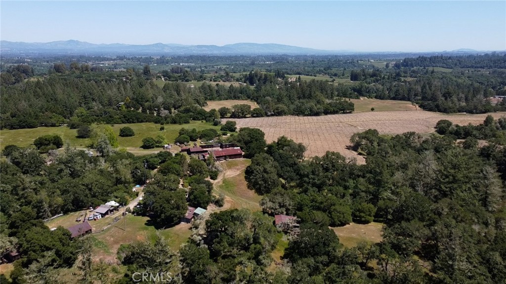 an aerial view of mountain with residential house