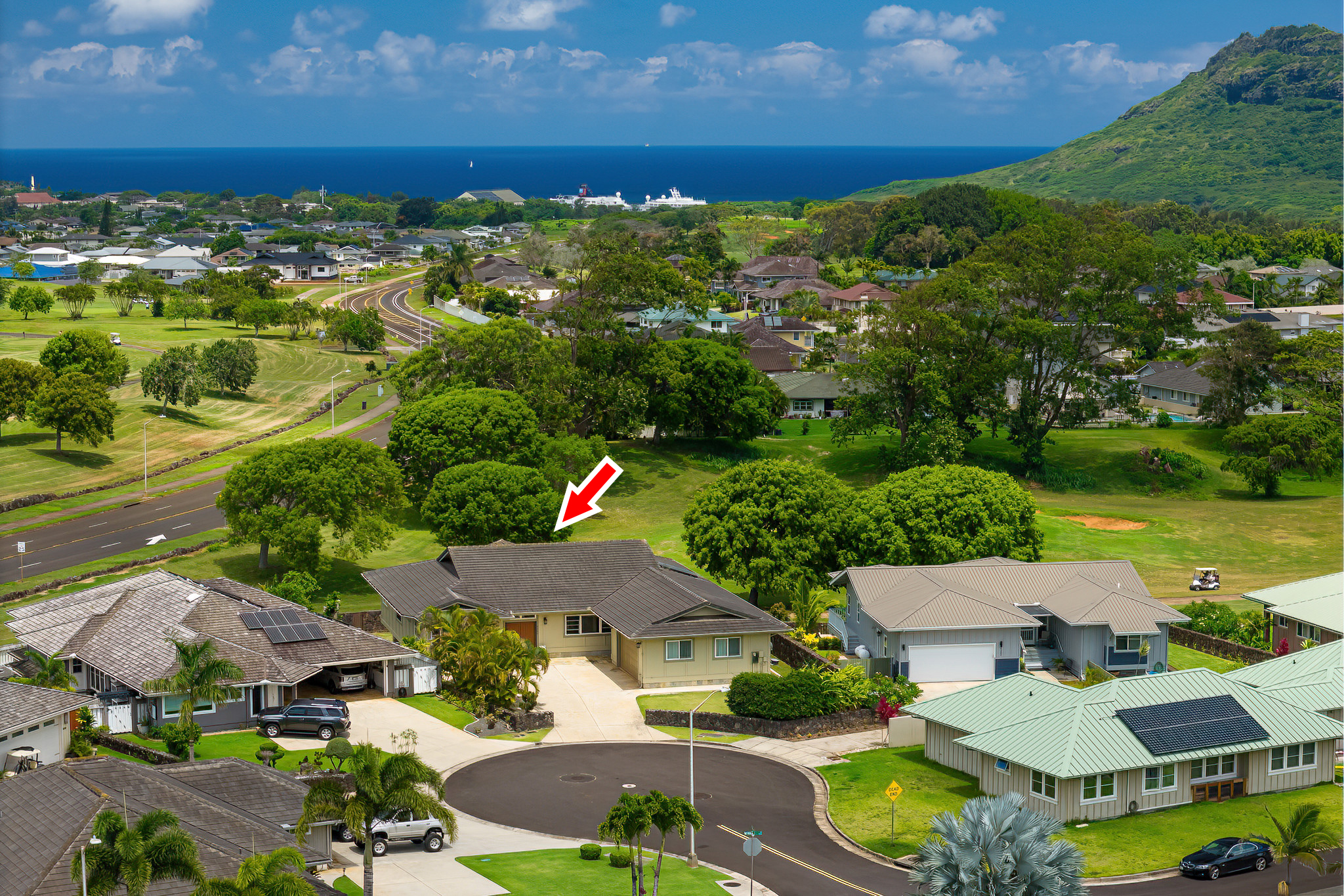 an aerial view of residential houses with outdoor space and street view