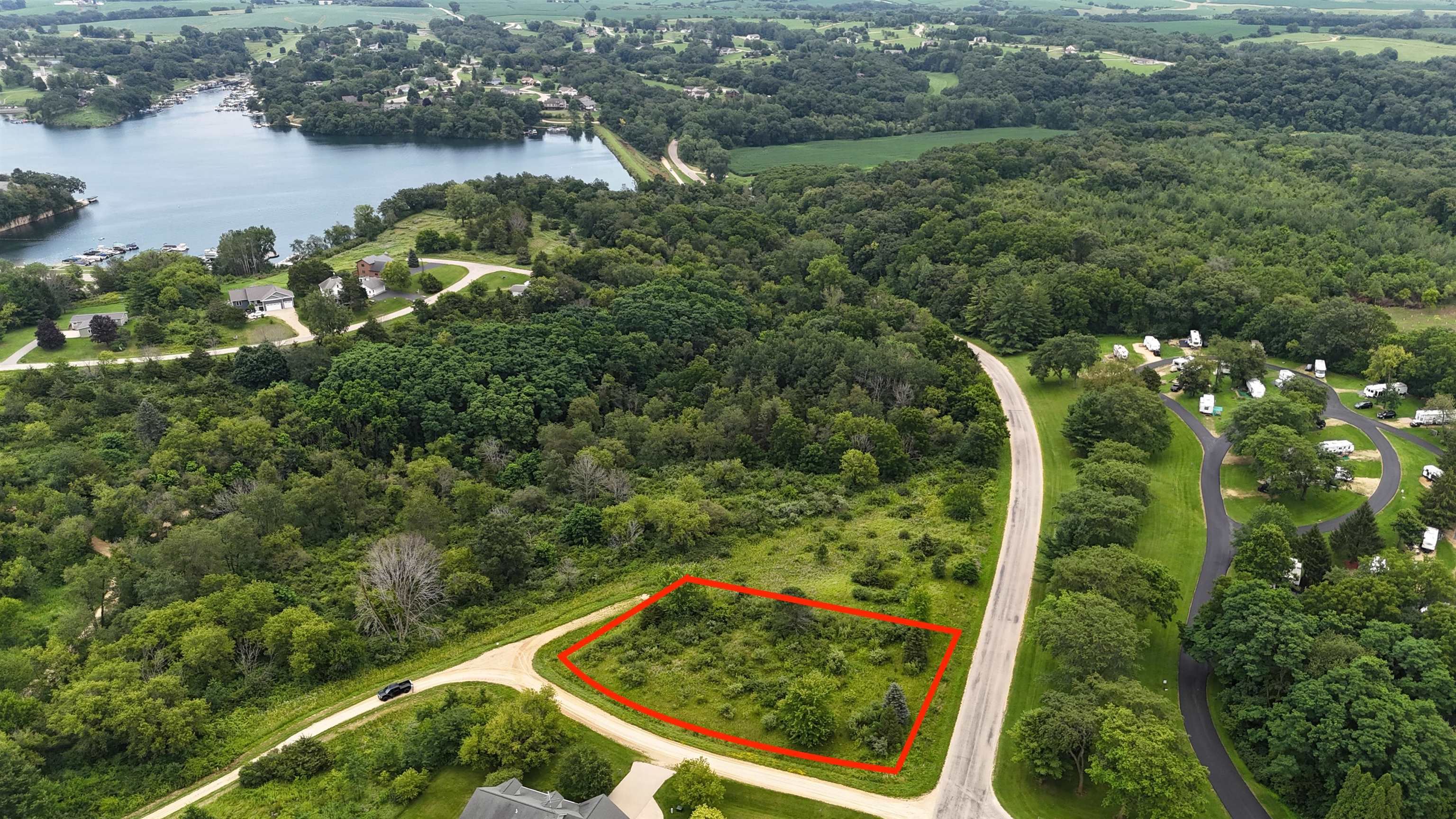 an aerial view of a residential houses with lake view