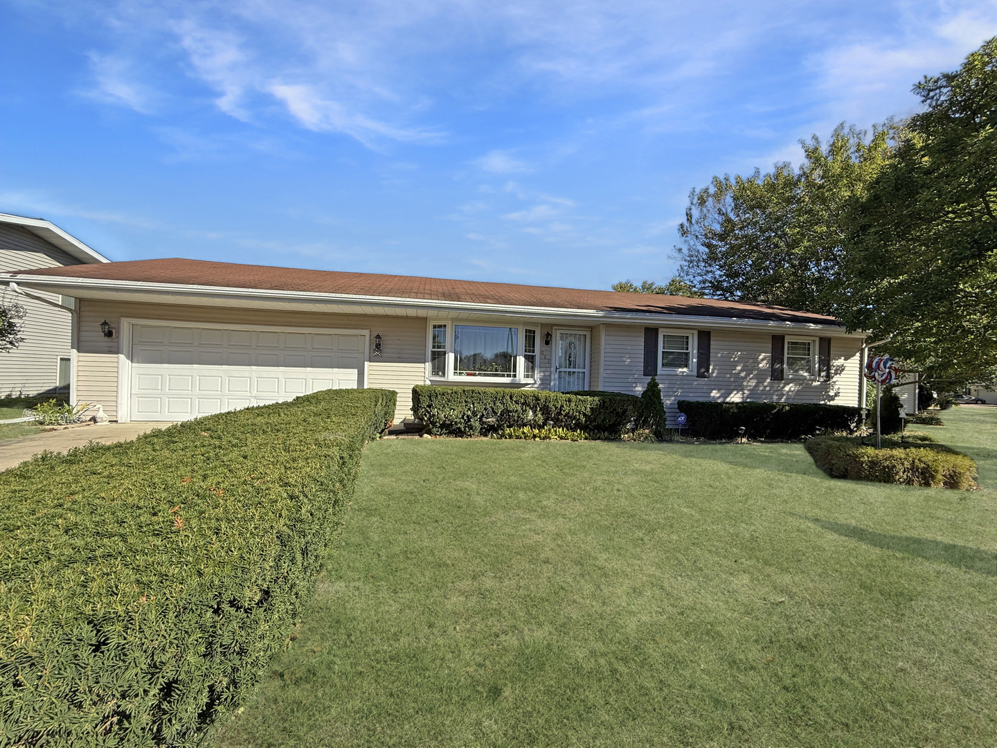 a view of house with outdoor space and yard