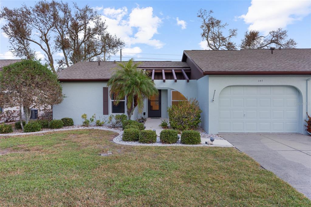 front view of a house with a yard