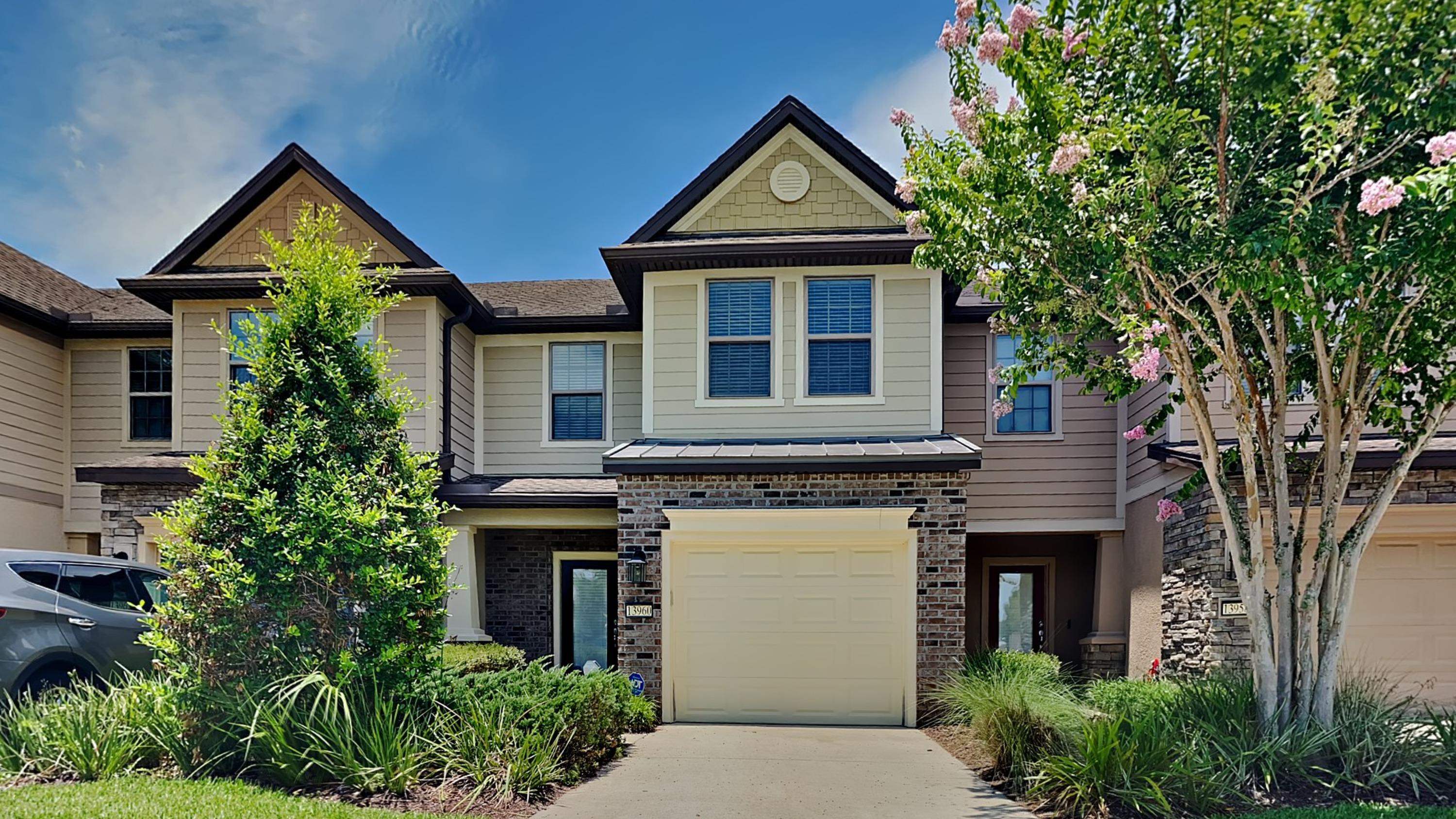 a front view of a house with garden