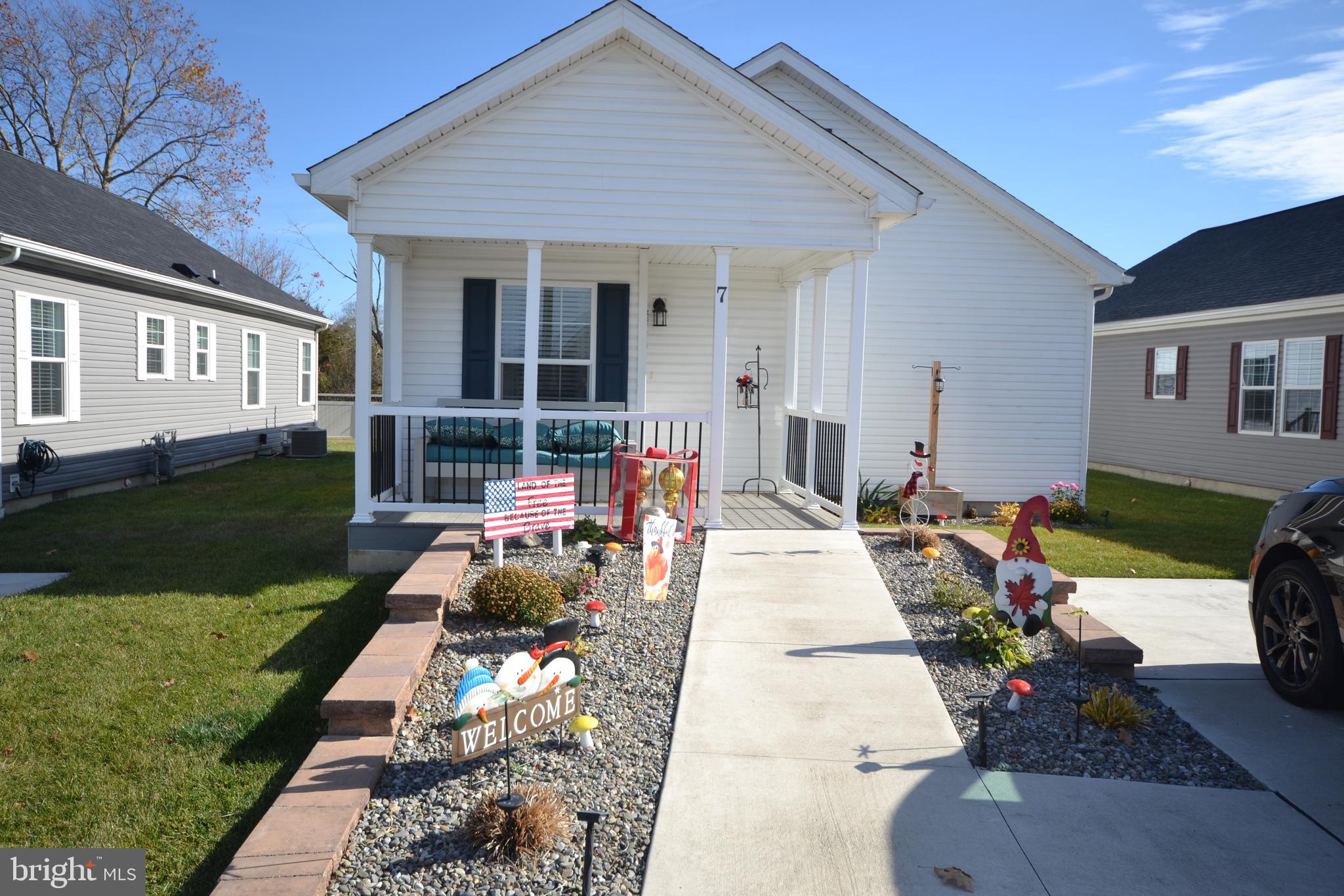 a view of a house with backyard sitting area and garden