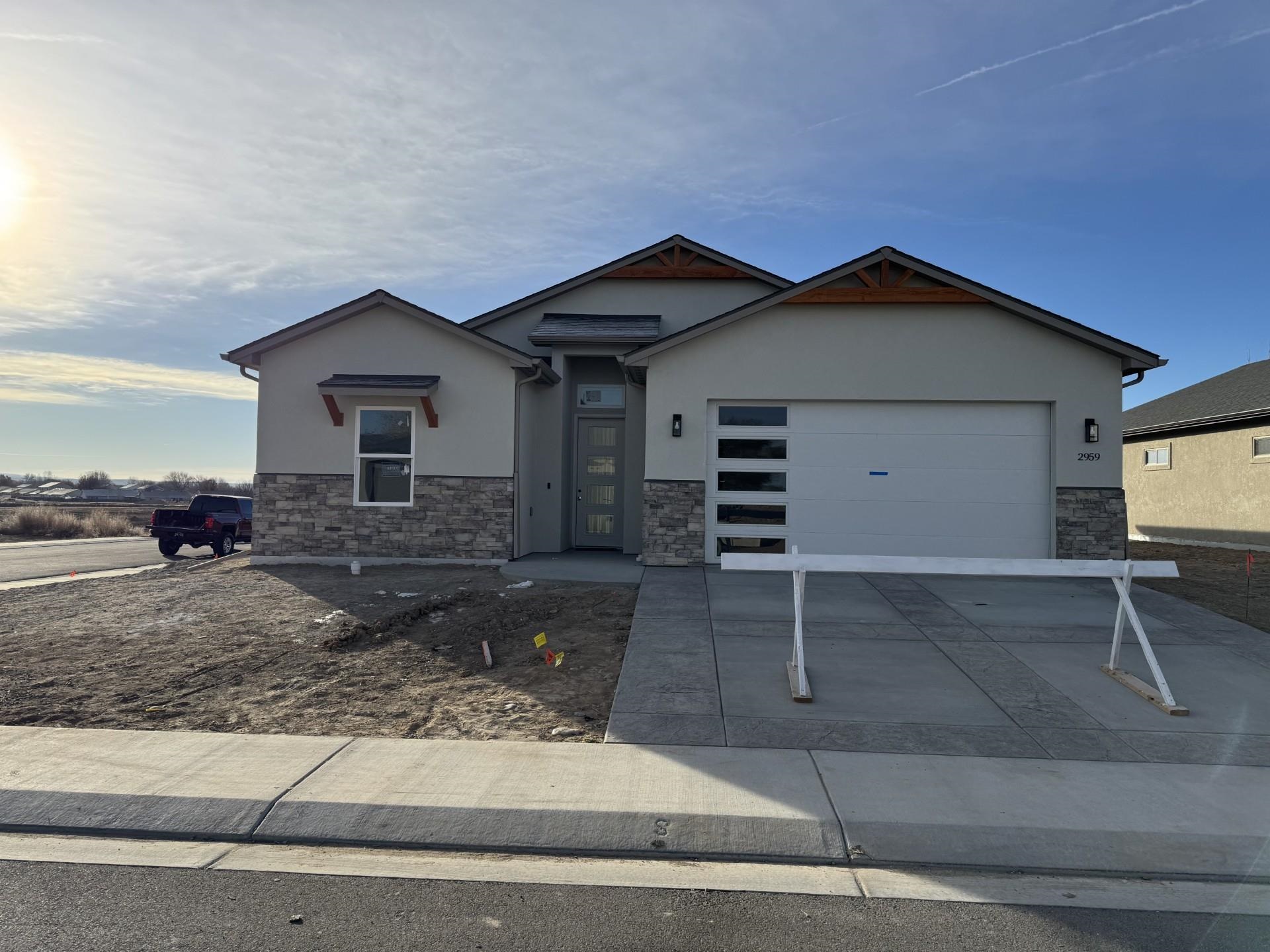 a front view of a house with garage